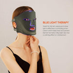 7 Color Rechargeable LED black facial light therapy mask with purple highlights and adjustable straps on model