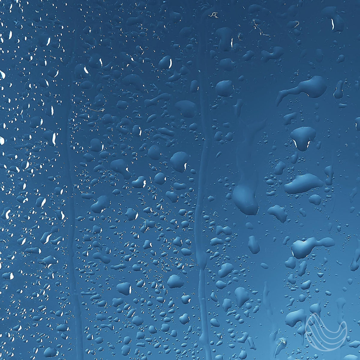 Clear glass surface covered in water droplets against a gradient blue background with vertical streaks