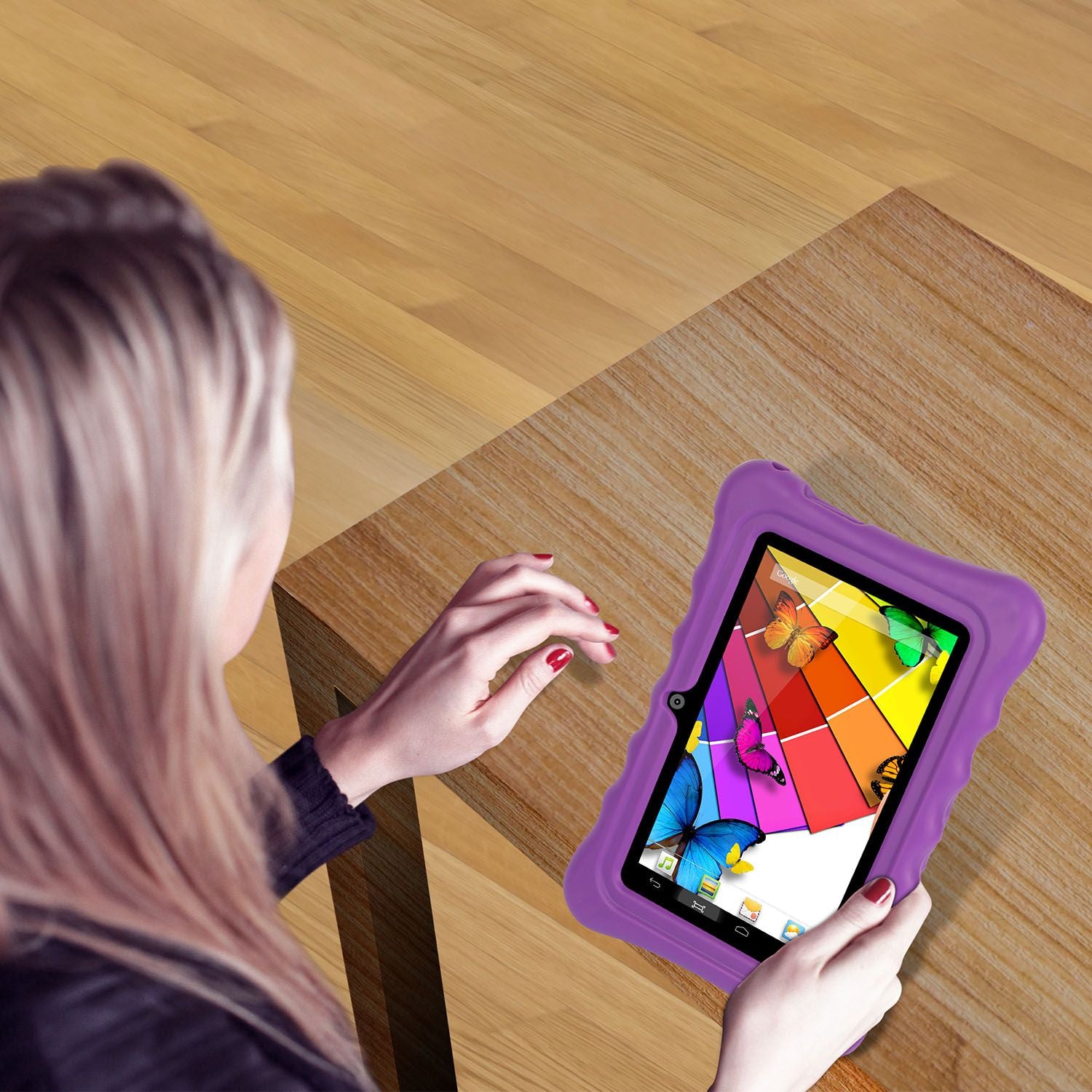 Woman enjoying a purple 7-inch tablet in a durable silicone case while sipping coffee.