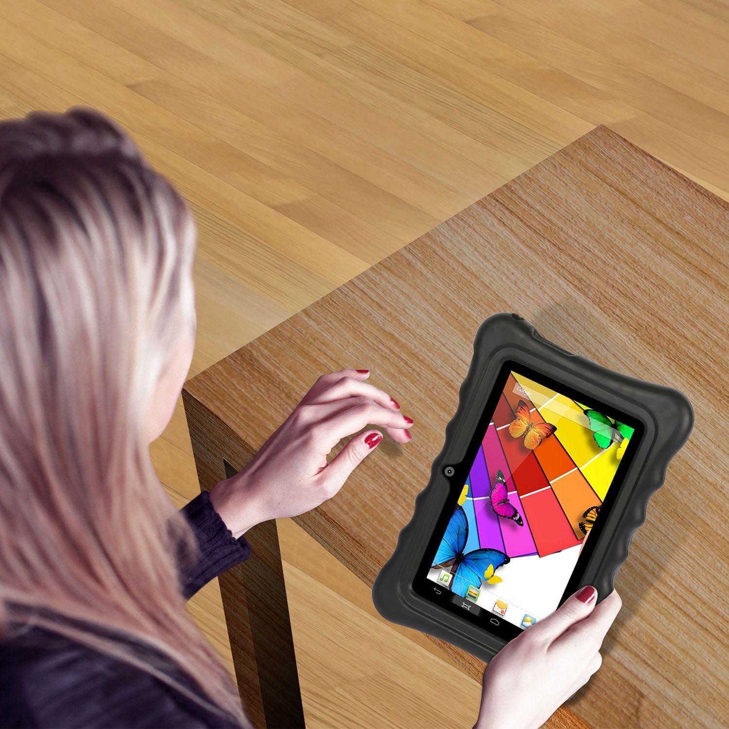 Woman holding a 7-inch tablet in a protective silicone case, illustrating its lightweight design and comfort.