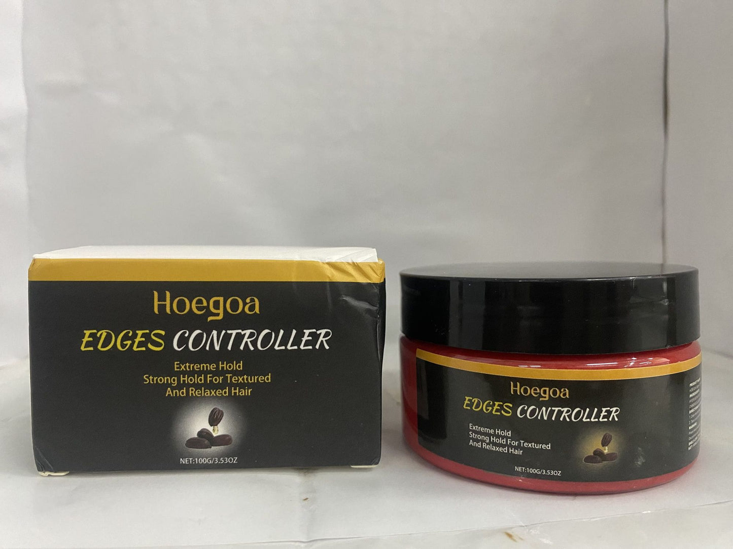Close-up of Hoegoa Edges Controller packaging next to the jar, featuring descriptions of extreme hold benefits.