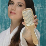 Eco-friendly bamboo paddle brush with natural wood grain and rubber cushion