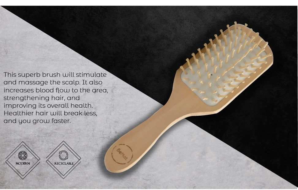 Eco-friendly bamboo paddle brush with natural wooden bristles and rubber cushion for detangling and scalp massage