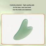 Gua Sha Board made from high quality green jade with smooth curved edges for face, neck, and back massage