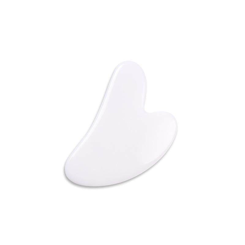 Heart-shaped rose quartz gua sha facial massage tool for contouring and lymphatic drainage