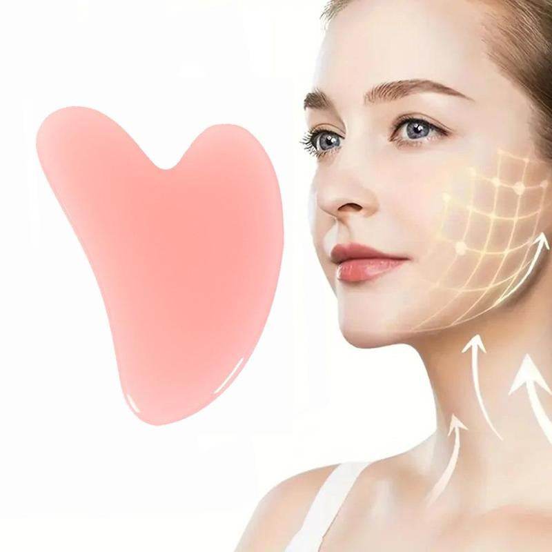 heart-shaped rose quartz gua sha tool for facial massage and contouring
