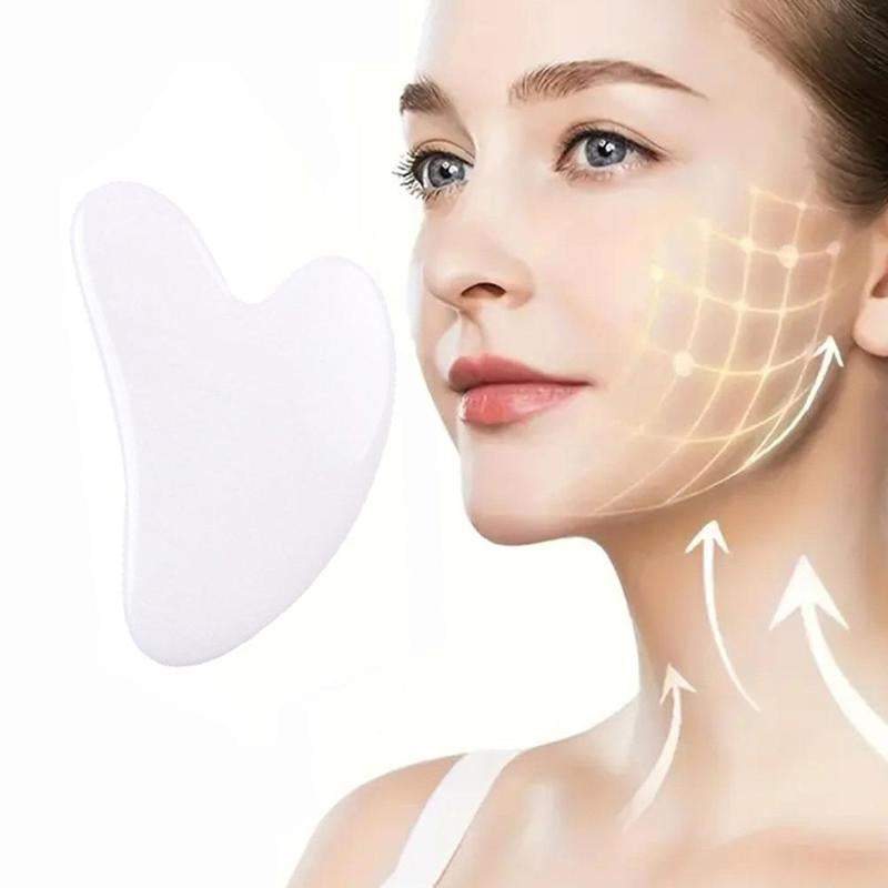 Heart-shaped rose quartz gua sha tool for facial massage and contouring