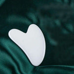 Heart-shaped rose quartz gua sha facial massage tool