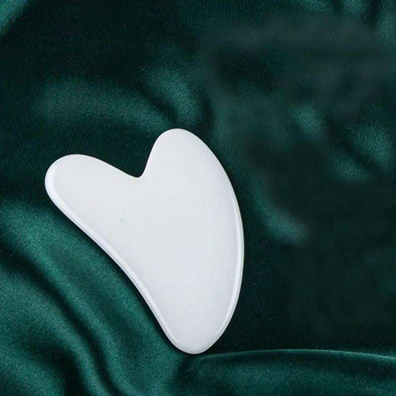 Heart-shaped rose quartz gua sha facial massage tool