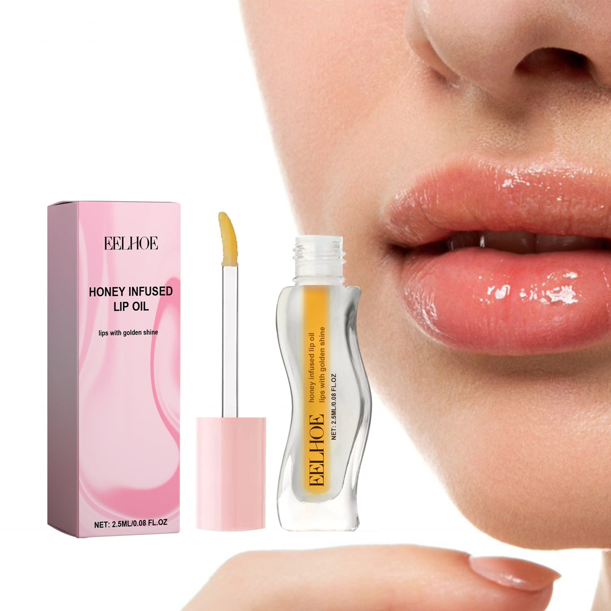 Honey Infused Lip Oil with light golden yellow oil in clear curved bottle and pink applicator beside glossy light pink lips