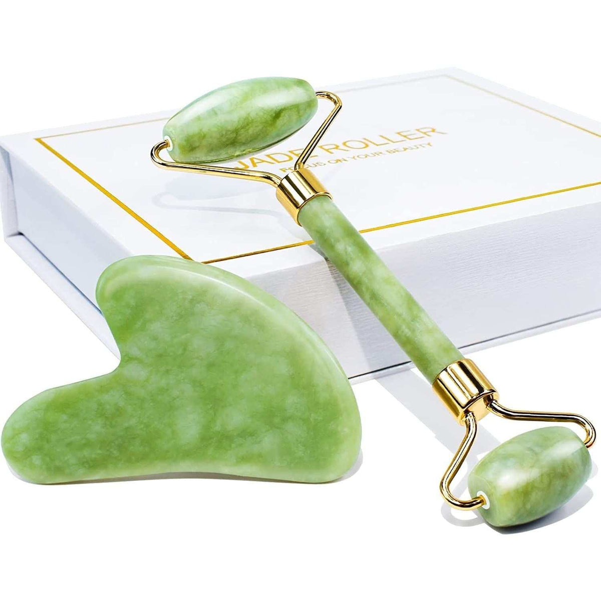 Jade Roller and Gua Sha set in green natural jade with dual-sided roller and smooth curved gua sha tool on white box