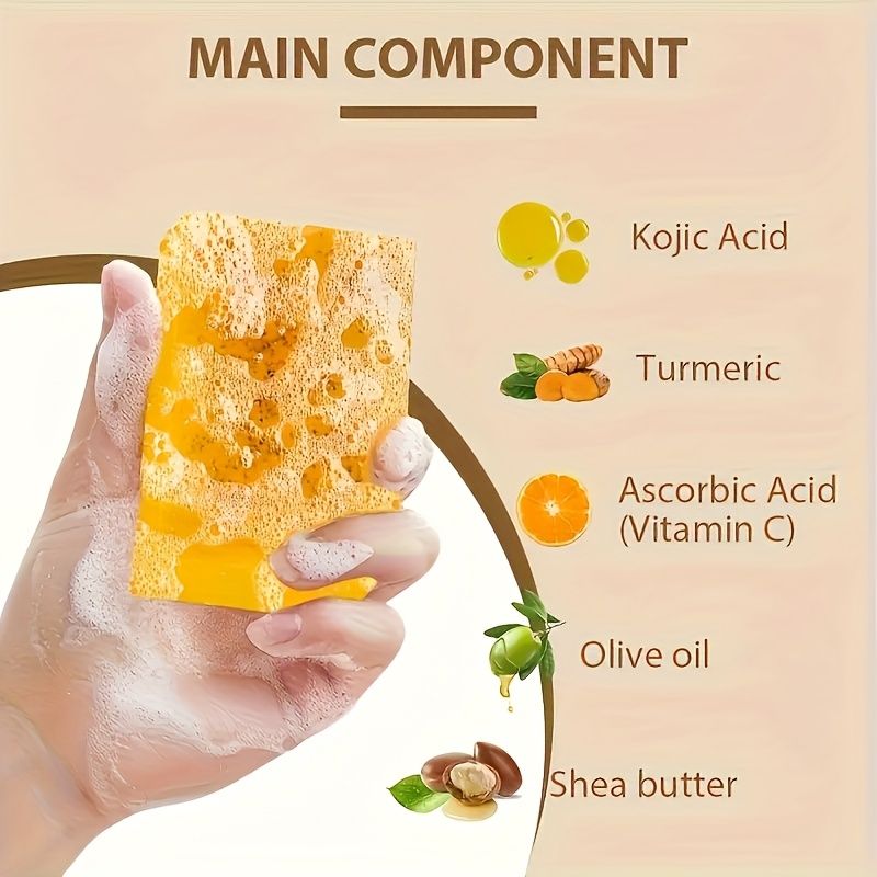 Natural Turmeric Soap bar held in a hand with creamy lather, featuring a marbled yellow and orange pattern
