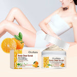 OCEAURA Orange Body Scrub cream jar and box with orange fruit slices and a woman with smooth legs in white attire