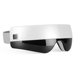 Portable Eye Mask Massager in sleek white and black plastic with adjustable gray strap and control buttons on the side