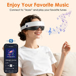 Portable Eye Mask Massager in white and black with adjustable strap, worn by a woman enjoying music playback from a connected smartphone app