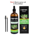 bottle of 100% pure thick black castor oil for hair and skin care