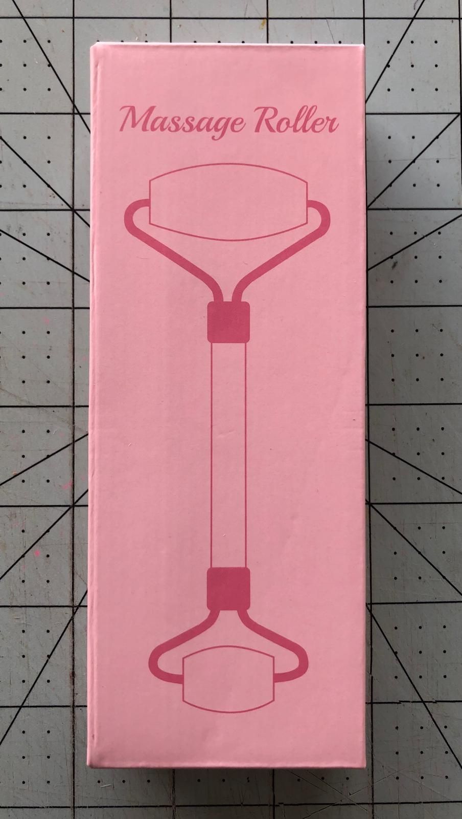 Rose Quartz Facial Roller packaging in pink with a simple illustration of a double-sided facial massage roller