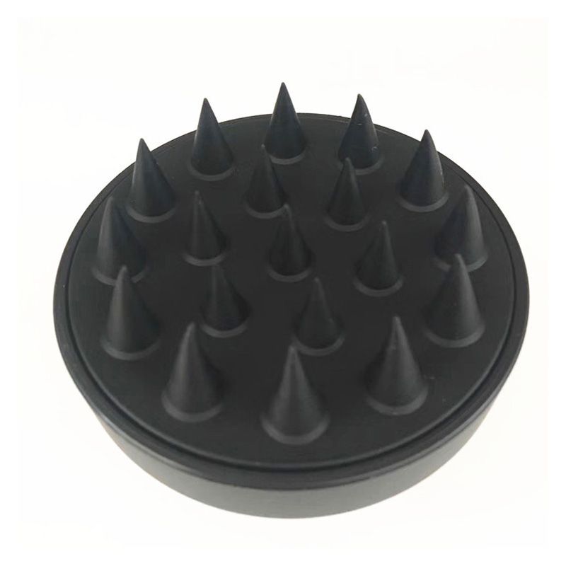 Scalp Care Brush in black silicone with pointed soft tips and round ergonomic grip for scalp massage and dandruff care