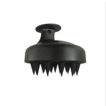 Black silicone scalp massager brush with soft tapered tips and ergonomic handle, ideal for a gentle Scalp Care Brush massage.