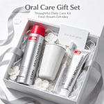 Stain Removing Mouthwash oral care gift set with silver and red bottles, a white cup, and a transparent toothbrush in a white box with silver ribbon