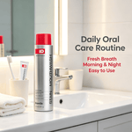 Stain Removing Mouthwash in a silver bottle with a red cap standing on a bathroom sink countertop next to a toothbrush holder and a white towel
