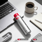 Stain Removing Mouthwash in a silver bottle with red cap, placed on a white desk with laptop, coffee cup, notebook, and toothbrush set nearby