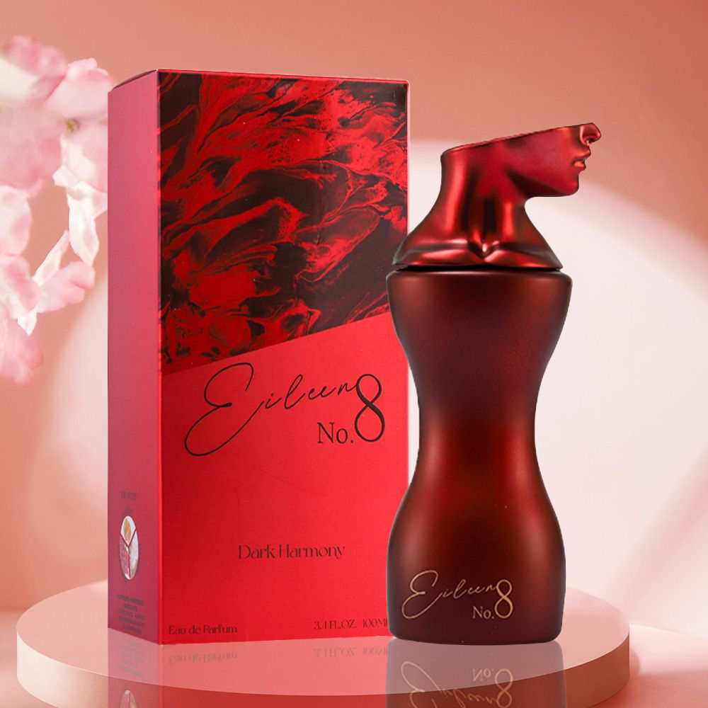 Sugar Red Berry Eau De Toilette in a red frosted glass bottle shaped like a stylized female bust with matching red and black marbled box