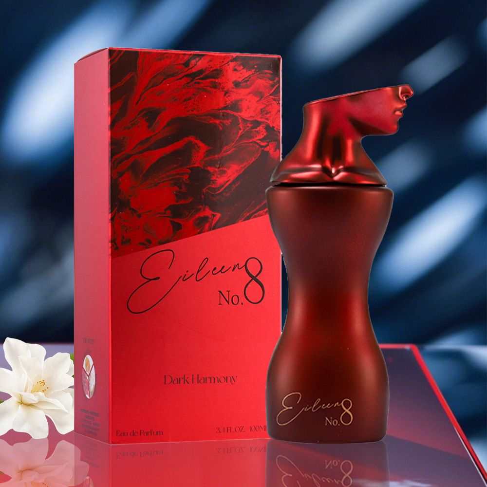 Sugar Red Berry Eau De Toilette in a matte red sculpted bottle shaped like a female torso with elegant black script, next to a matching red and black patterned box