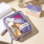 Travel Body Care Set with purple reusable zipper pouch, includes shower oil, body butter, and fragrance spray in travel size bottles