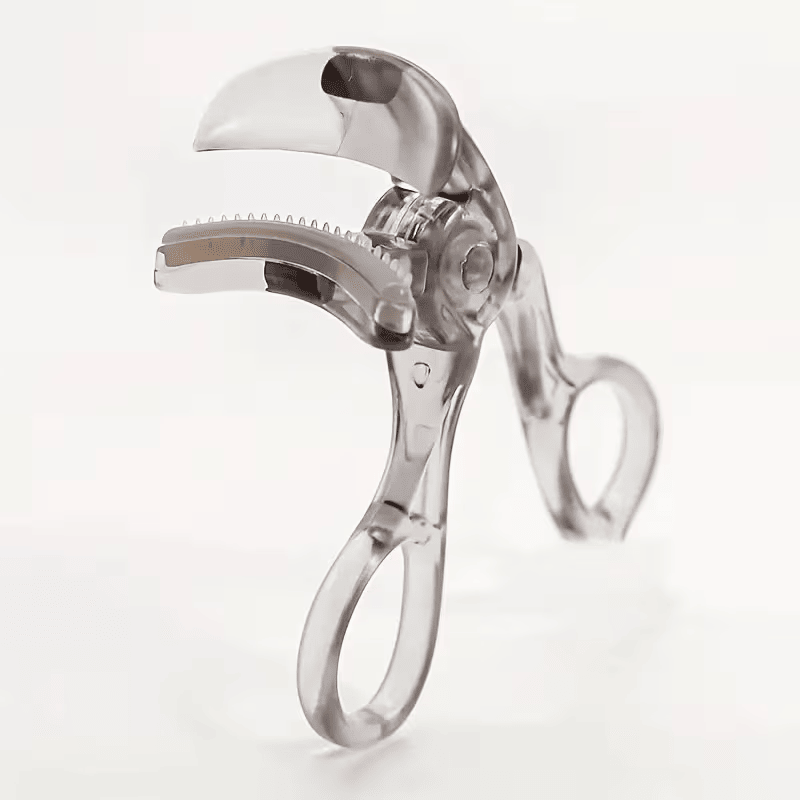 Travel-Friendly Wide-Angle Eyelash Curler with clear plastic body, soft silicone tips, ergonomic handles, and built-in lash comb for precise application.