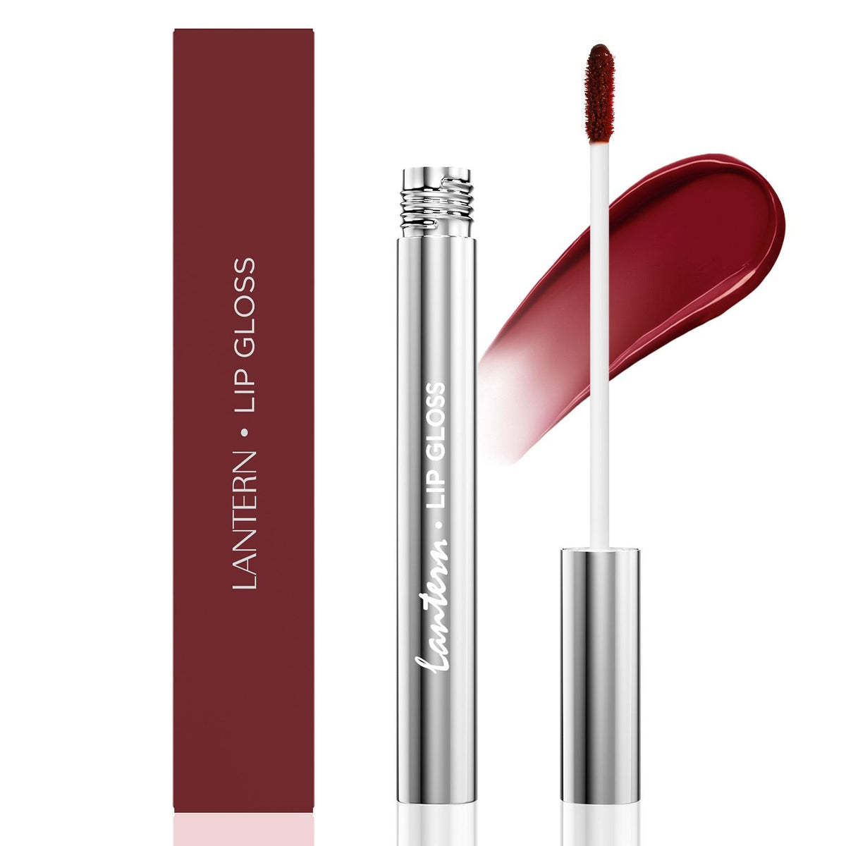 Ultra-Hydrating Lip Gloss in a sleek silver tube with deep berry red shade and applicator wand