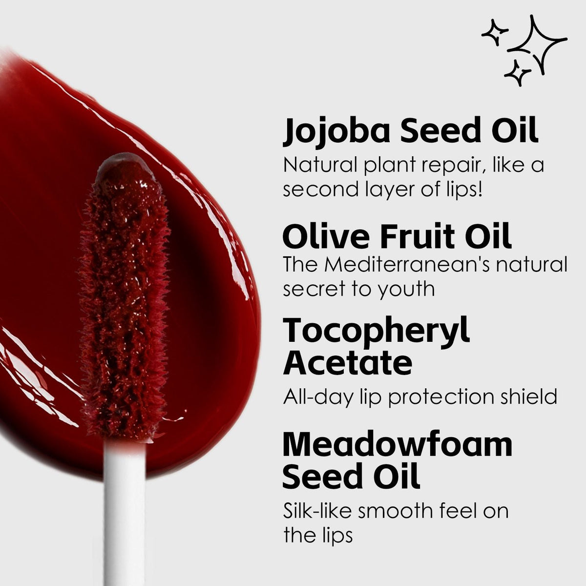 Ultra-Hydrating Lip Gloss in deep red shade with glossy, smooth texture and doe-foot applicator showing rich pigmentation and shine