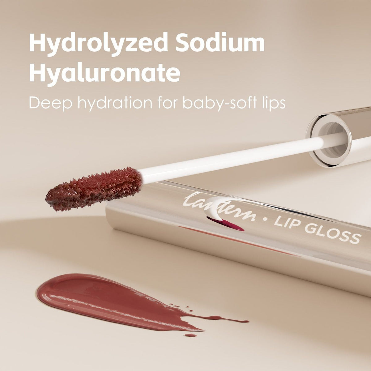 Ultra-Hydrating Lip Gloss in rose mauve with applicator wand and smooth glossy texture swatch for plumping hydration