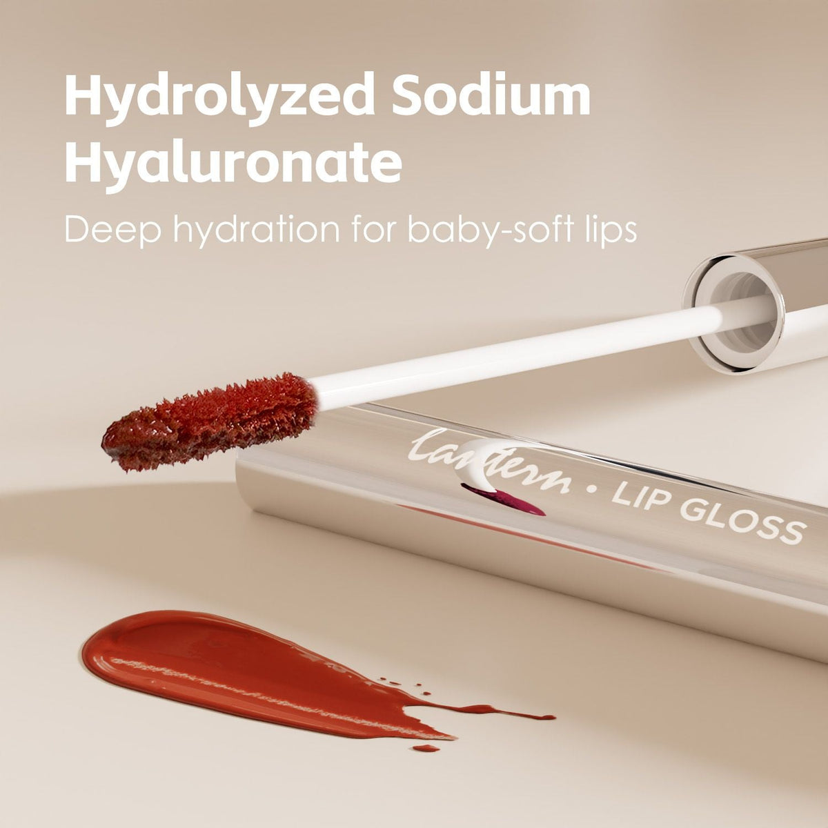 Ultra-Hydrating Lip Gloss in warm amber shade with smooth applicator and glossy swatch showcasing deep hydration and shine
