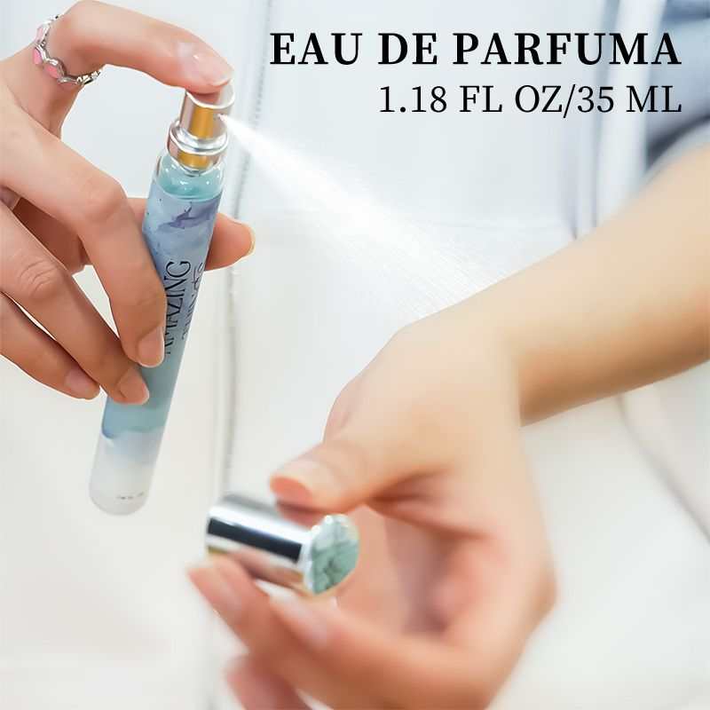 Compact women's Eau De Parfum spray bottle with blue and white gradient design, 1.18 fl oz size being applied on wrist